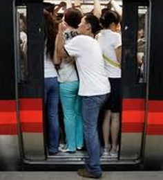 A man struggles in the subway.